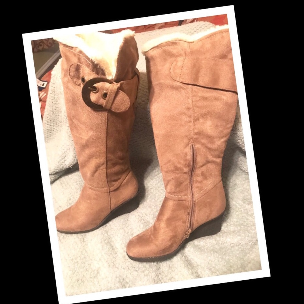 Tan knee-high boots, cream fur lining.
